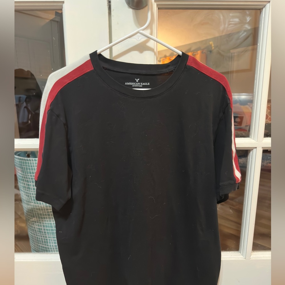 Men’s American Eagle like-new black shirt with red and white striped shoulder